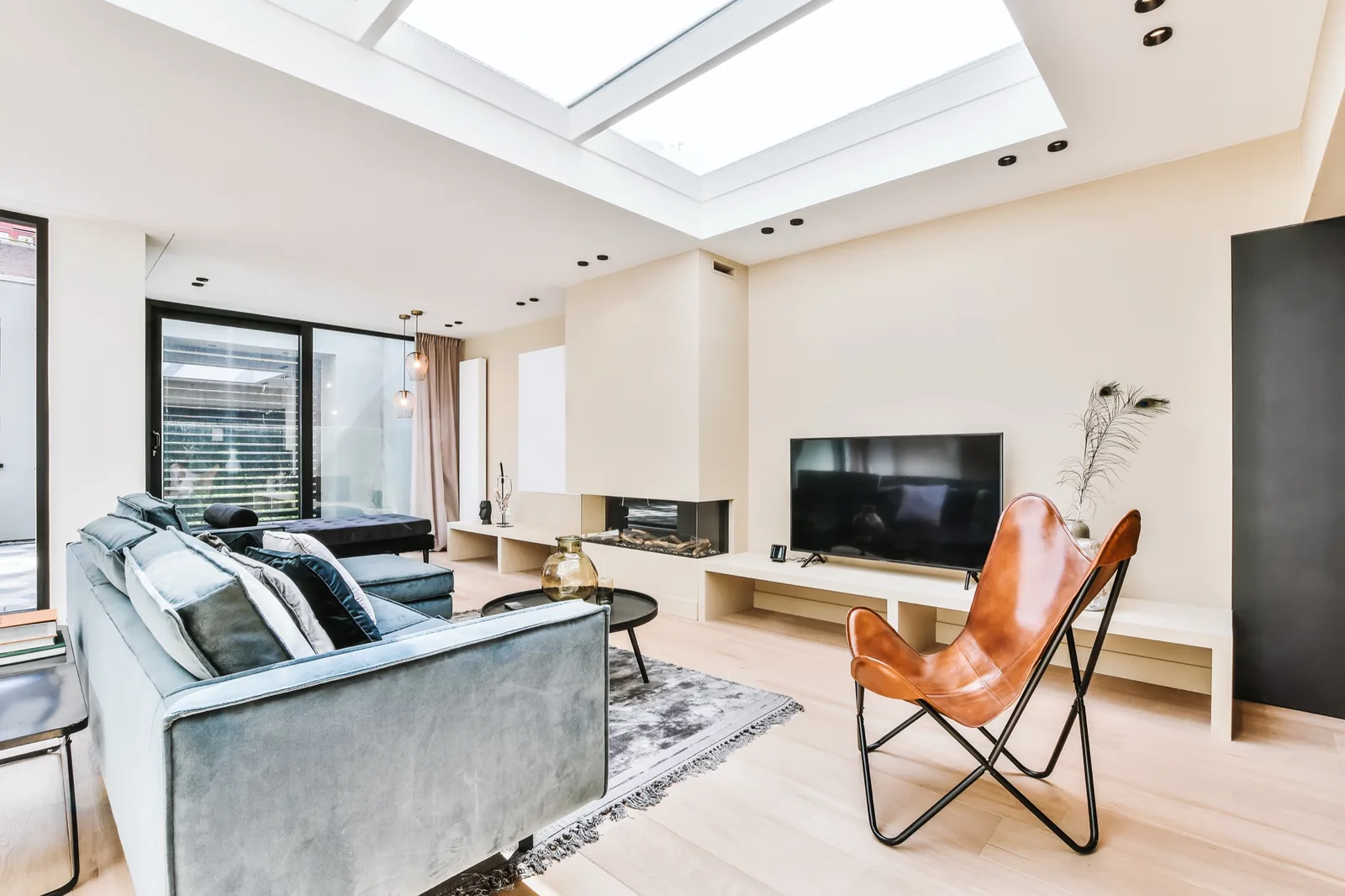 Bright San Diego living room with modern furniture under a skylight